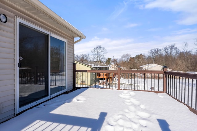 view of snow covered deck