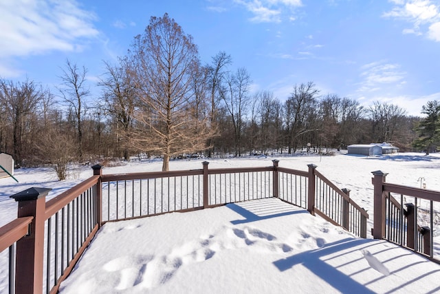 view of snow covered deck