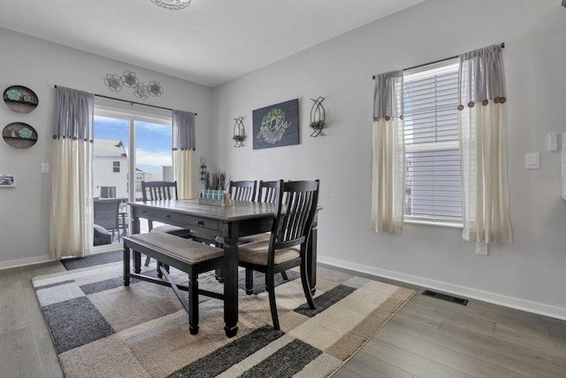 dining space featuring hardwood / wood-style floors