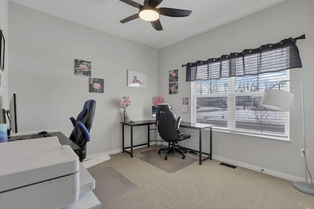 office featuring light carpet and ceiling fan