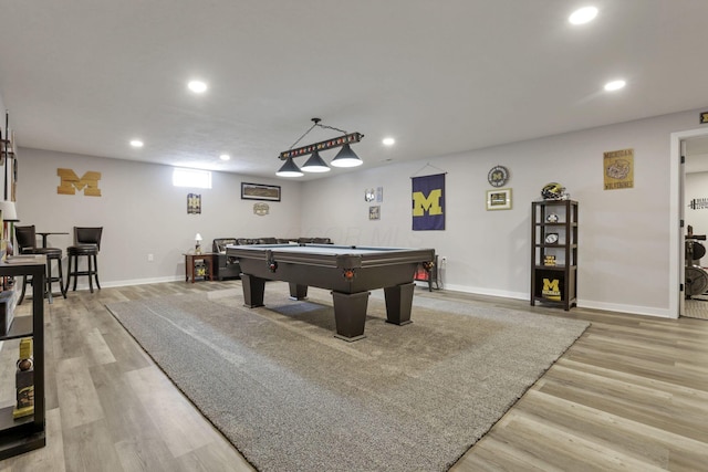 recreation room with billiards and light hardwood / wood-style flooring