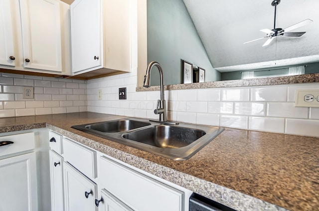 kitchen with sink, white cabinetry, tasteful backsplash, vaulted ceiling, and ceiling fan