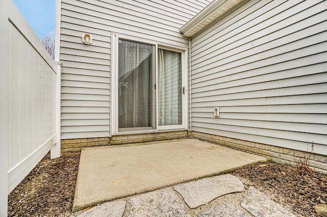 doorway to property featuring a patio area