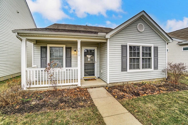 exterior space featuring a porch and a front yard