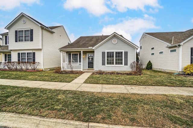 view of front of property featuring a front yard and covered porch