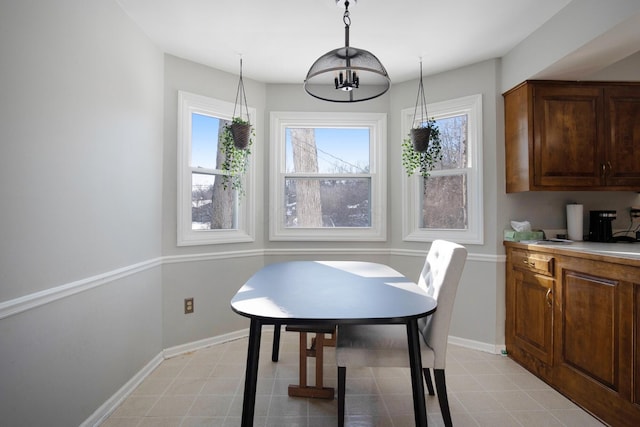 dining area featuring a notable chandelier