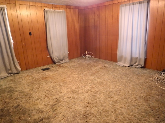 unfurnished room with carpet flooring