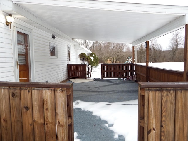 view of snow covered deck