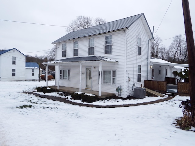 front facade with central AC and covered porch