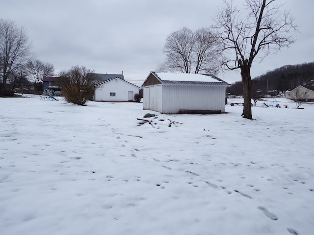 view of yard covered in snow