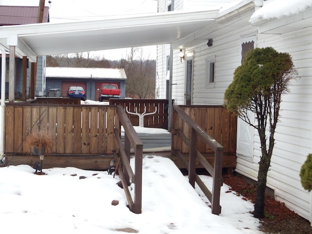 view of snow covered deck