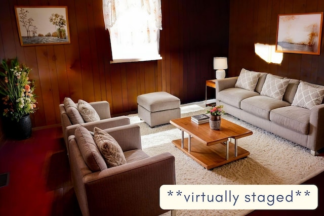 living room featuring carpet flooring and wooden walls