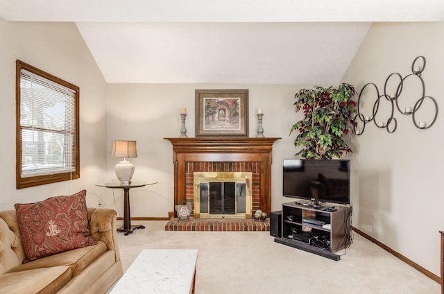 carpeted living room with lofted ceiling and a brick fireplace