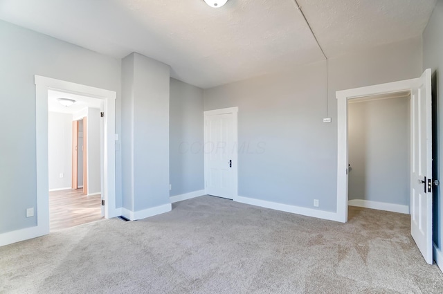 unfurnished bedroom featuring light colored carpet