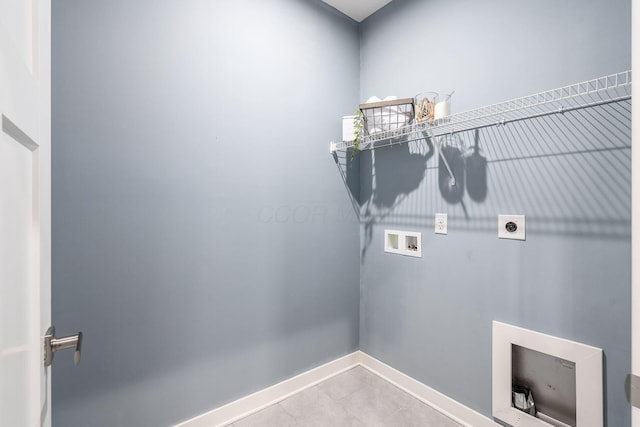 laundry area featuring washer hookup, tile patterned flooring, and electric dryer hookup