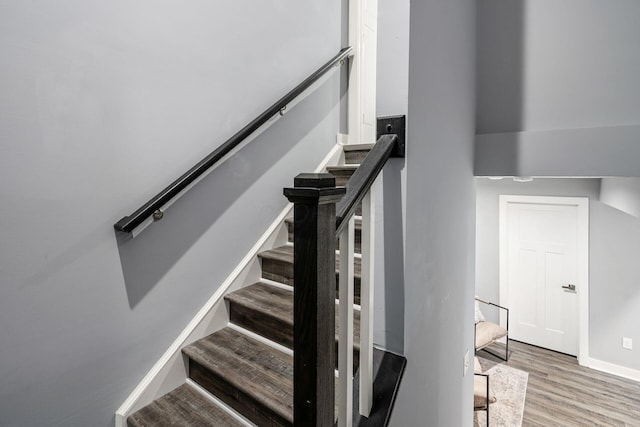 stairs with wood-type flooring