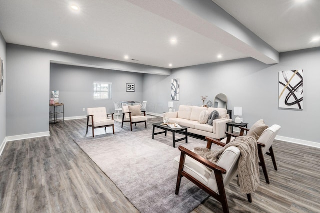 living room with dark hardwood / wood-style flooring