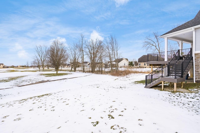 view of yard layered in snow