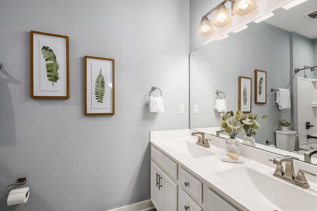 bathroom with vanity and toilet