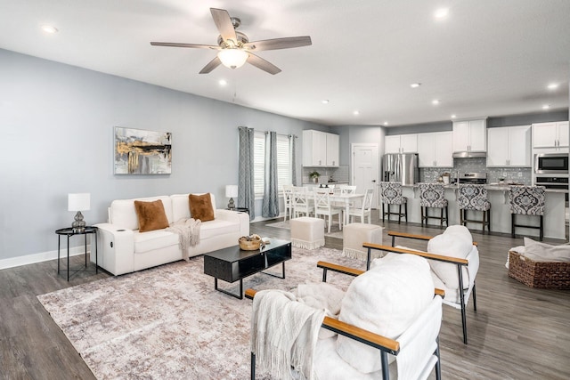 living room with hardwood / wood-style floors and ceiling fan