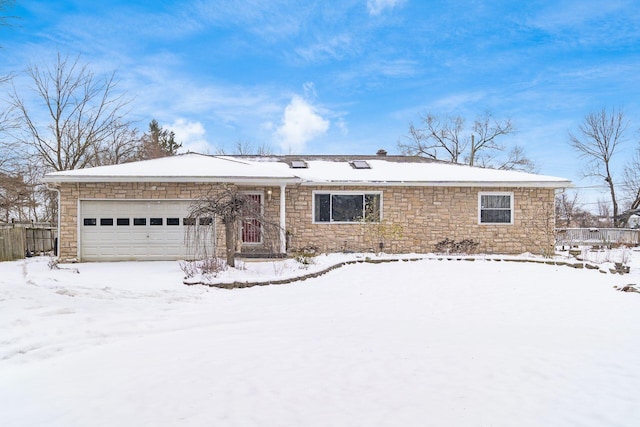 ranch-style house featuring a garage