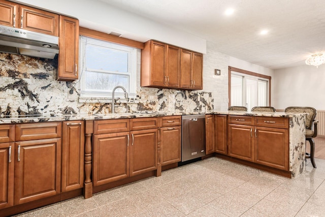 kitchen with kitchen peninsula, dishwasher, backsplash, and light stone countertops