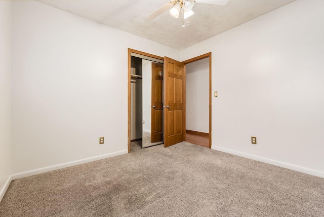 unfurnished bedroom featuring carpet flooring, ceiling fan, and a closet