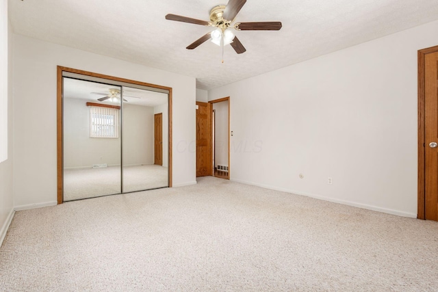 unfurnished bedroom featuring ceiling fan and a textured ceiling