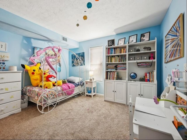 carpeted bedroom featuring a textured ceiling