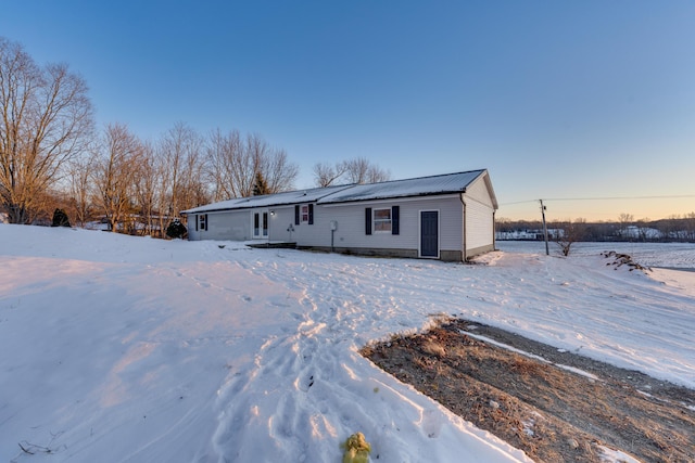 view of snow covered house