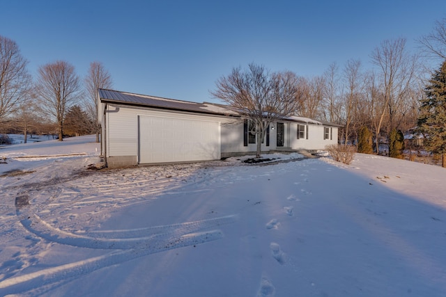 ranch-style home with a garage