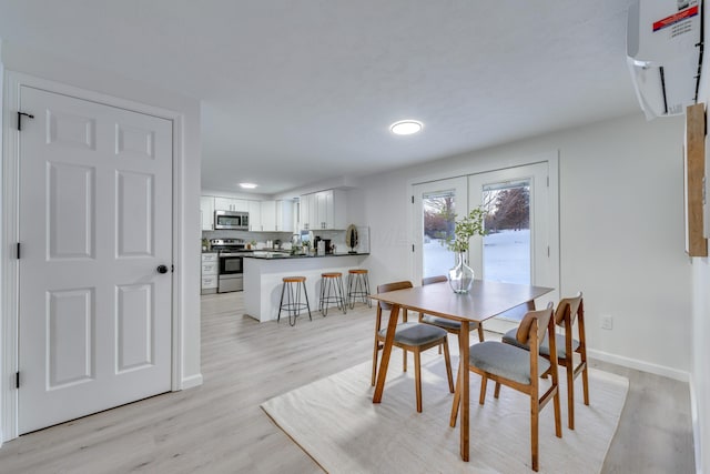 dining space featuring light hardwood / wood-style floors