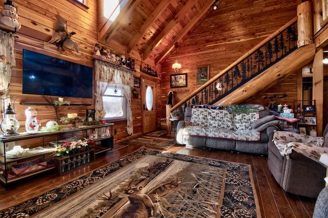 living room with high vaulted ceiling, wooden walls, dark hardwood / wood-style floors, beamed ceiling, and wood ceiling