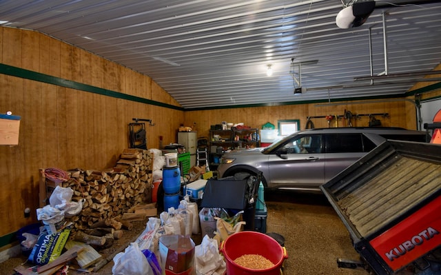 garage featuring wood walls