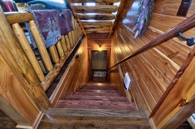 staircase featuring hardwood / wood-style floors