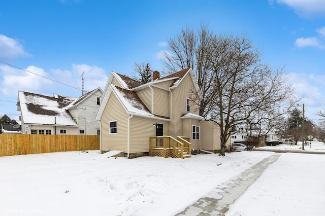 view of snow covered house