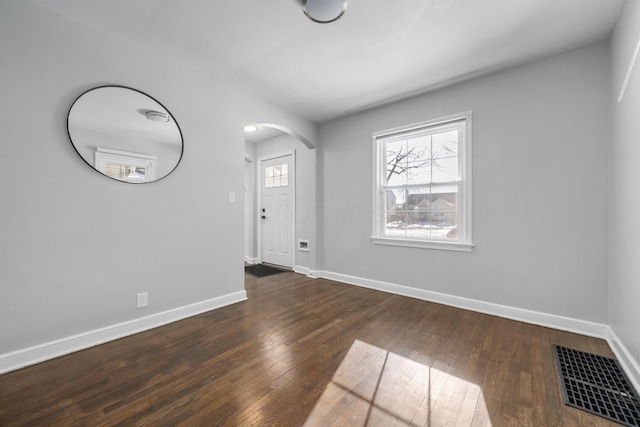 foyer with dark hardwood / wood-style floors