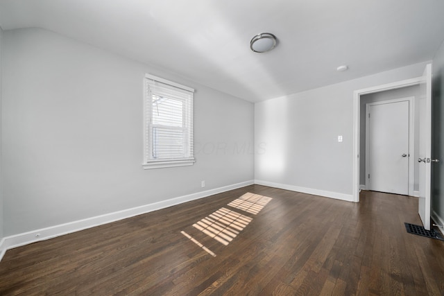 additional living space featuring dark hardwood / wood-style floors