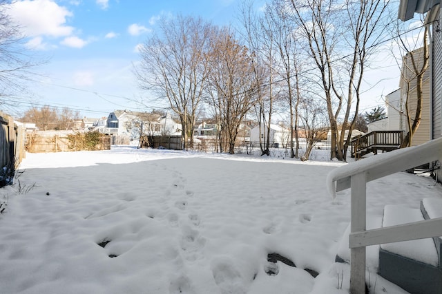 view of yard layered in snow