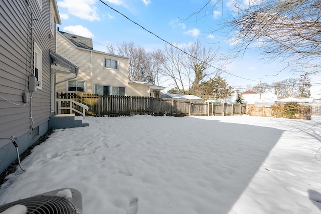 view of yard layered in snow