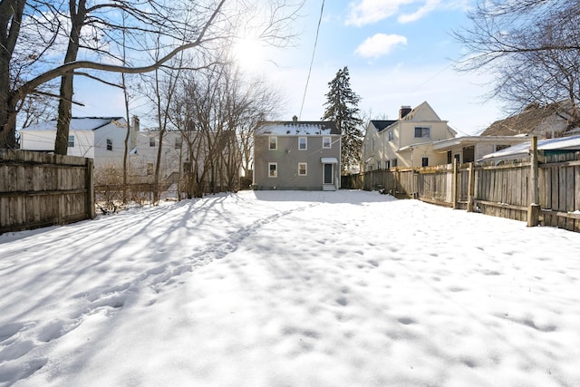 view of yard layered in snow