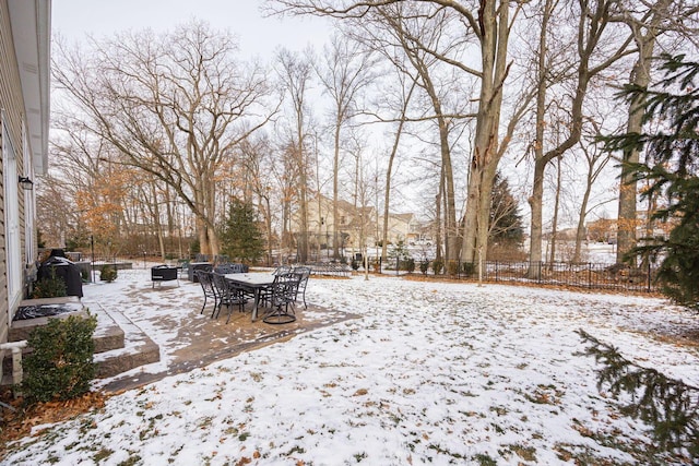 view of yard layered in snow