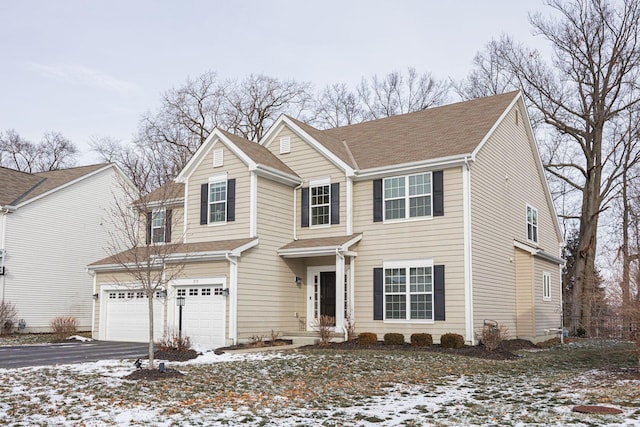 view of front of home with a garage