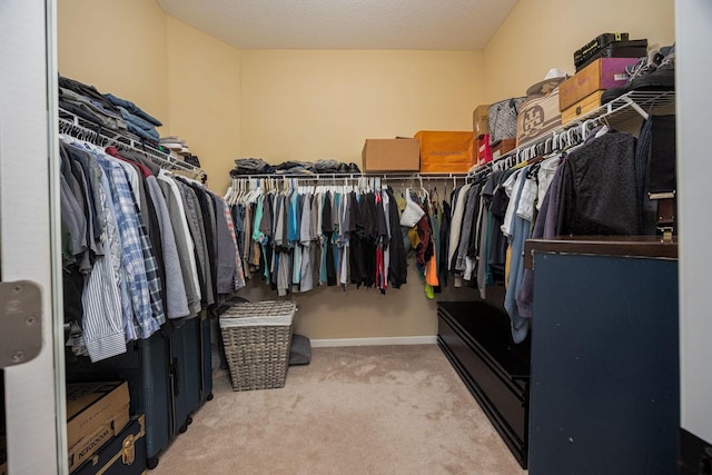 spacious closet with carpet floors