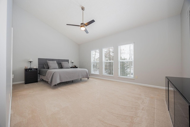 carpeted bedroom with vaulted ceiling and ceiling fan