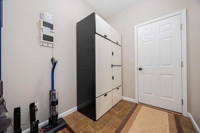 interior space with dark tile patterned floors