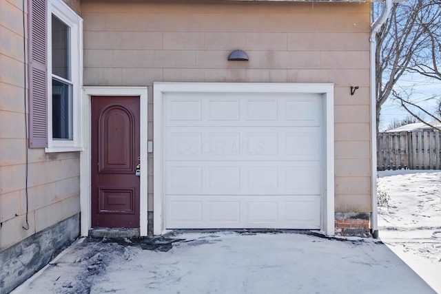 view of snow covered garage