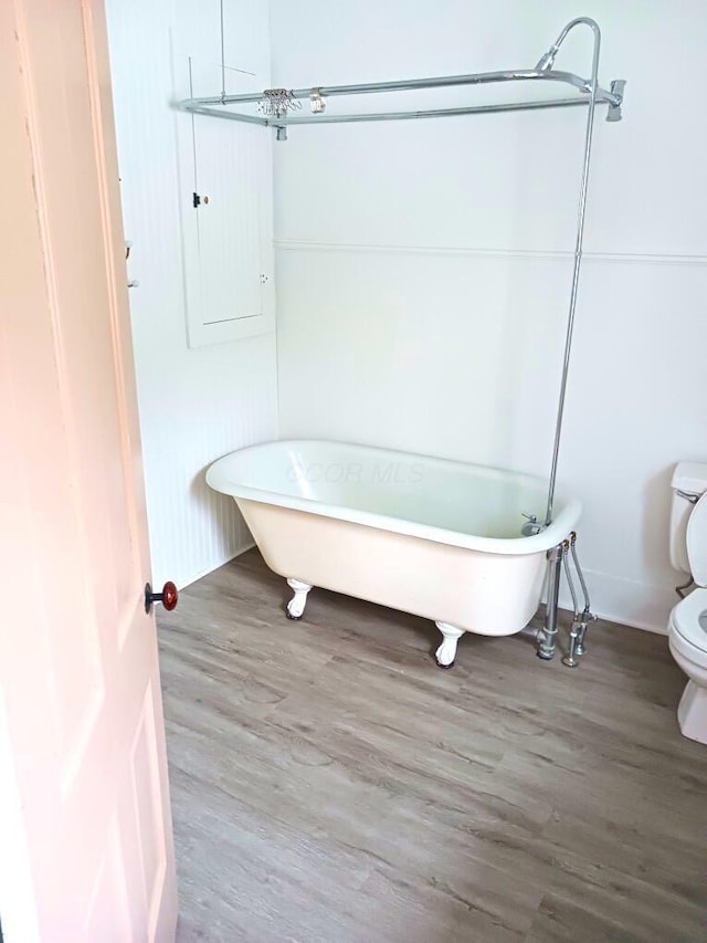 801 S Walnut St, Bucyrus, OH 44820 - full bath featuring a freestanding tub and wood finished floors
