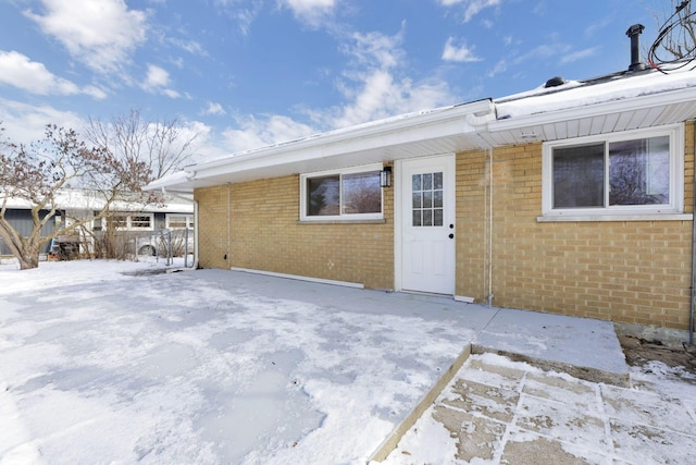 view of snow covered house