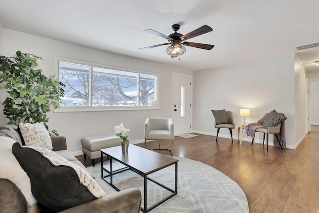 living room with ceiling fan and hardwood / wood-style flooring